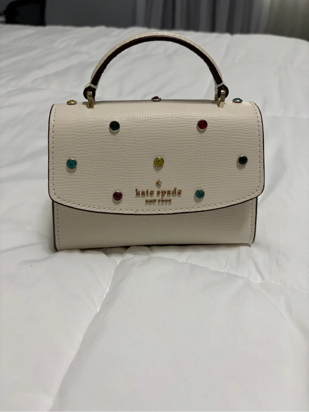 Limited edition kate spade cream mini top-handle bag with multicolor studs
